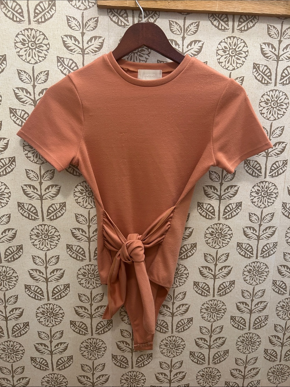 Tie-Front Short Sleeve Bodysuit in Rust/Peach Color